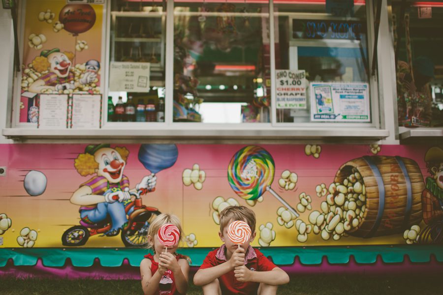 fun children's portrait with lollipops and colorful background at the MN state fairgrounds