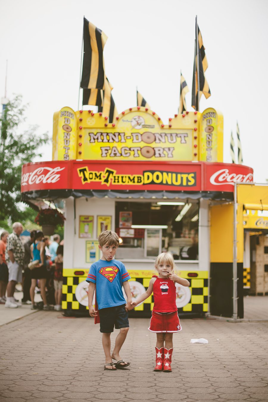 Colorful fun children's portrait at donut stand at the Minnesota State Fair