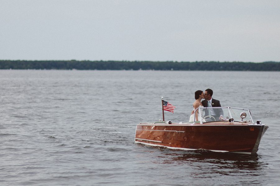 boat kiss gull lake brainerd wedding photographer