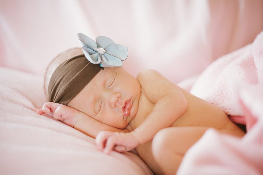 Sleeping newborn girl photo with headband